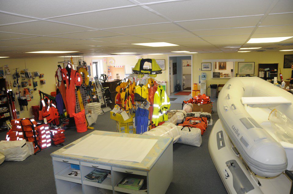 retail space with boats and marine safety gear